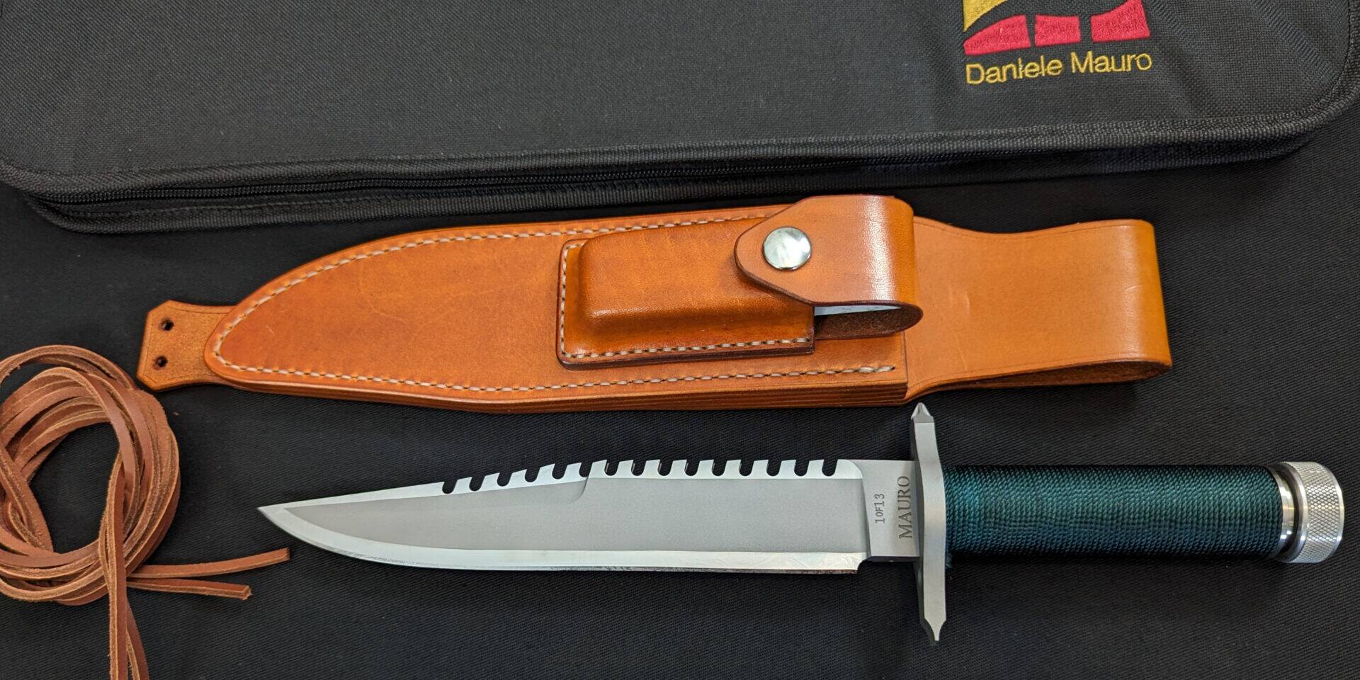 A knife from the numbered 1of13 run of 2023 with the leather sheath and thong