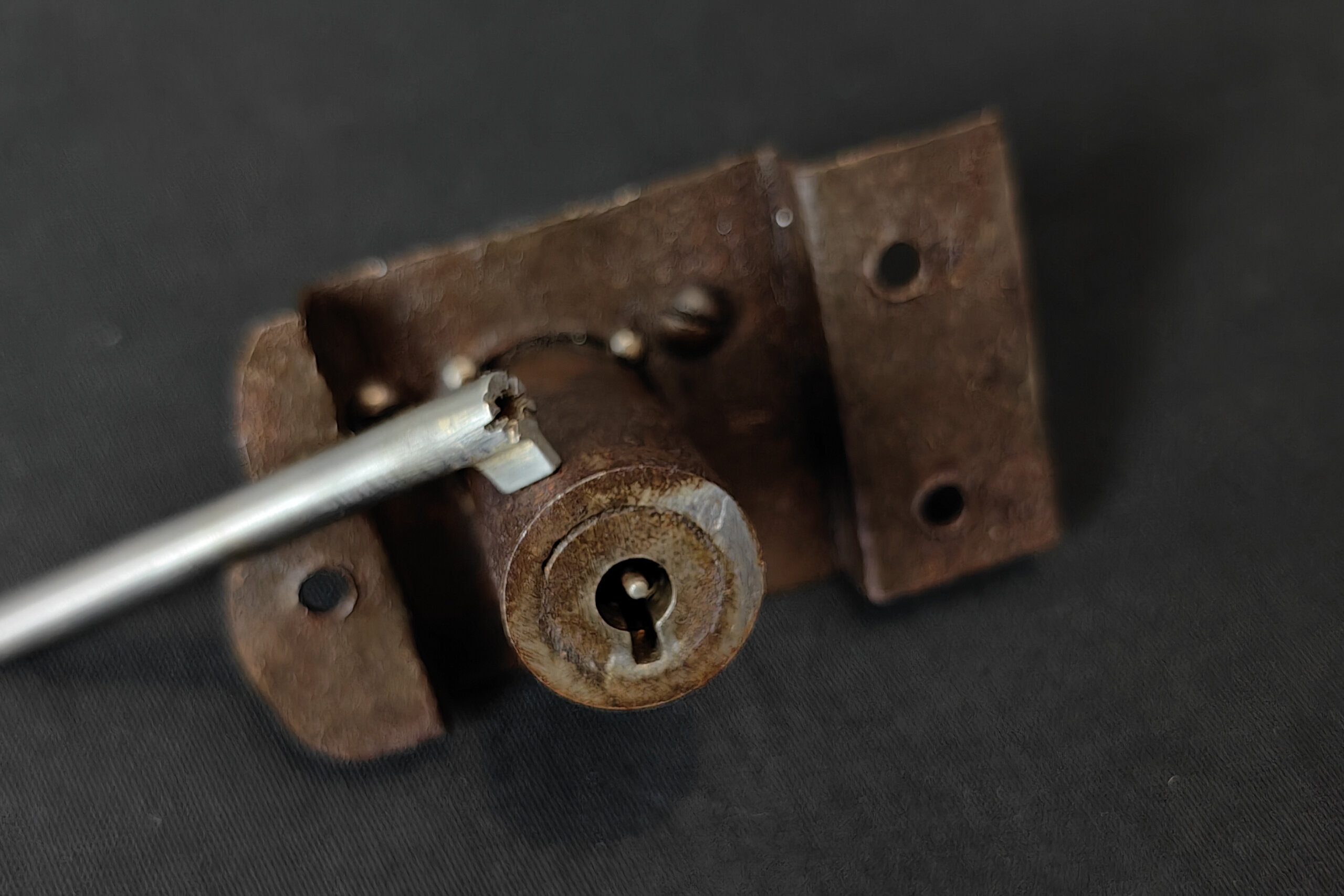 A push key in the lock of an early twentieth-century safe