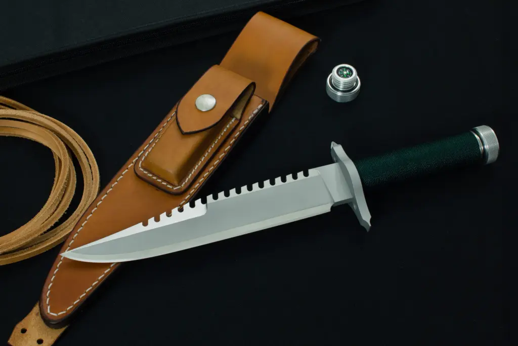 First Blood replica with a polished false edge, leather sheath and compass cap