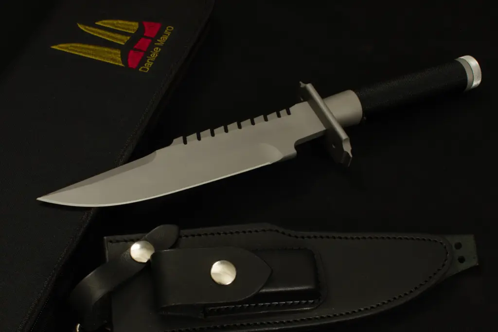 Replica of Jack Crain's LS-1 beside the black leather sheath with its press studs