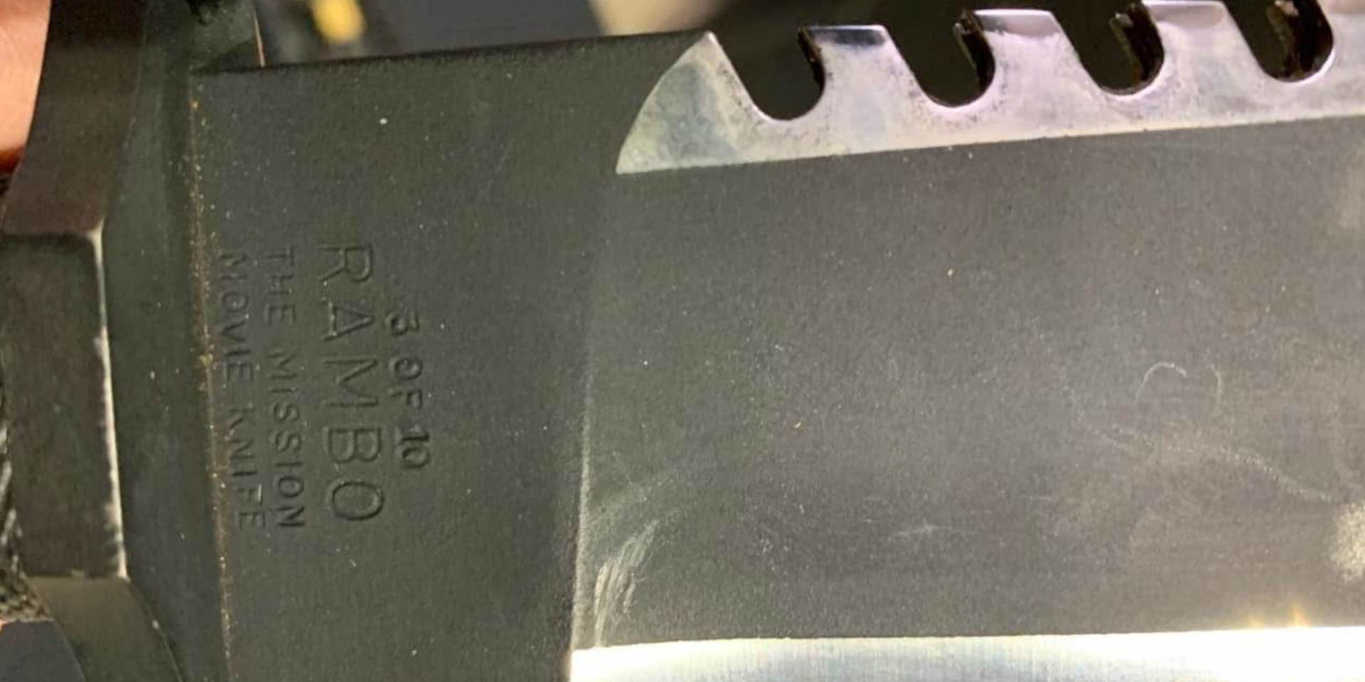 Close-up of the stamp on the heel: 3 OF 10, RAMBO, THE MISSION MOVIE KNIFE