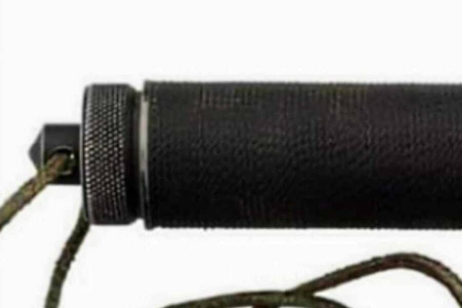 The handle cap of an original Jimmy Lile Mission, seen in profile with the cord