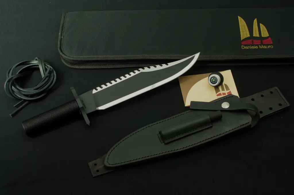 The Mission from the right with its leather cord, compass, card and sheath
