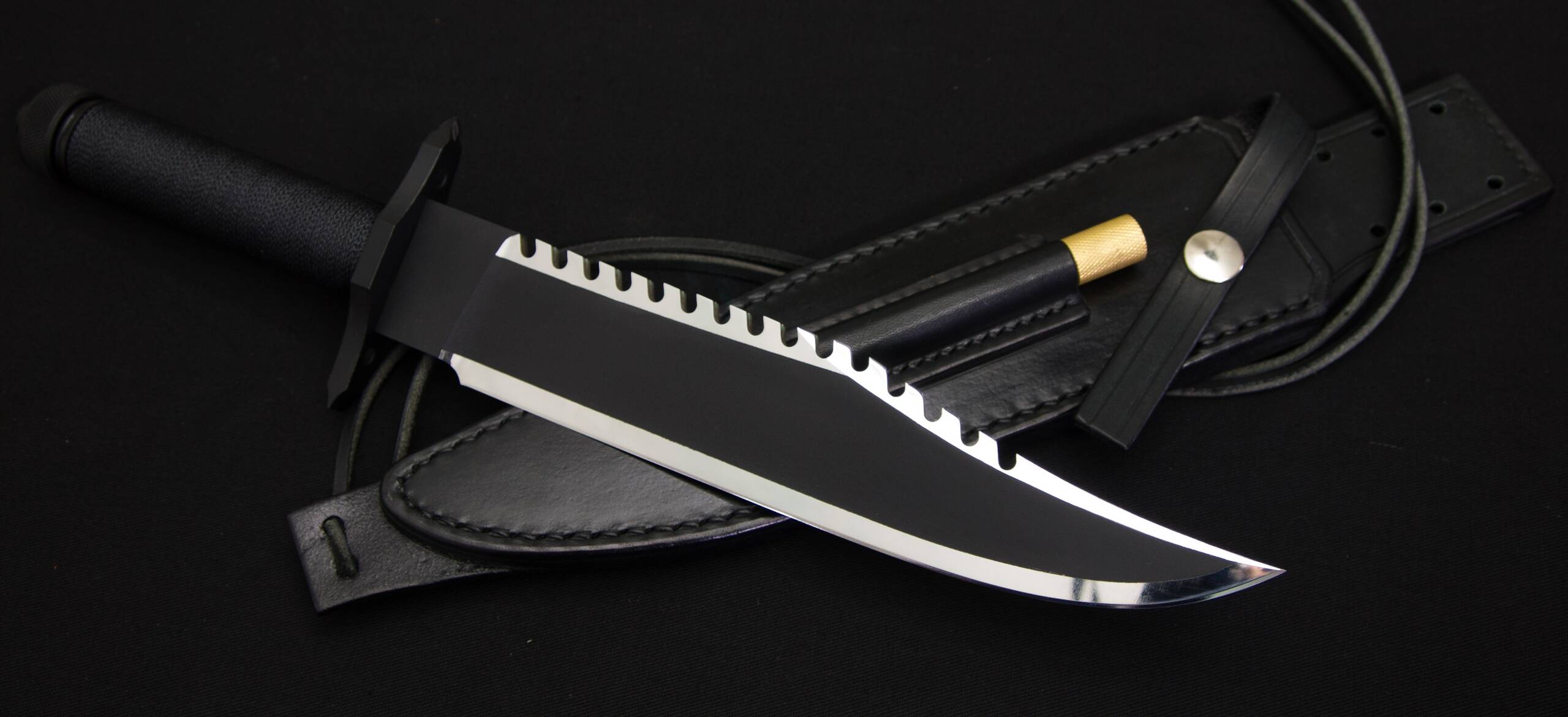 The Mission from the right resting on the leather sheath, with the cord and the brass-capped sharpener