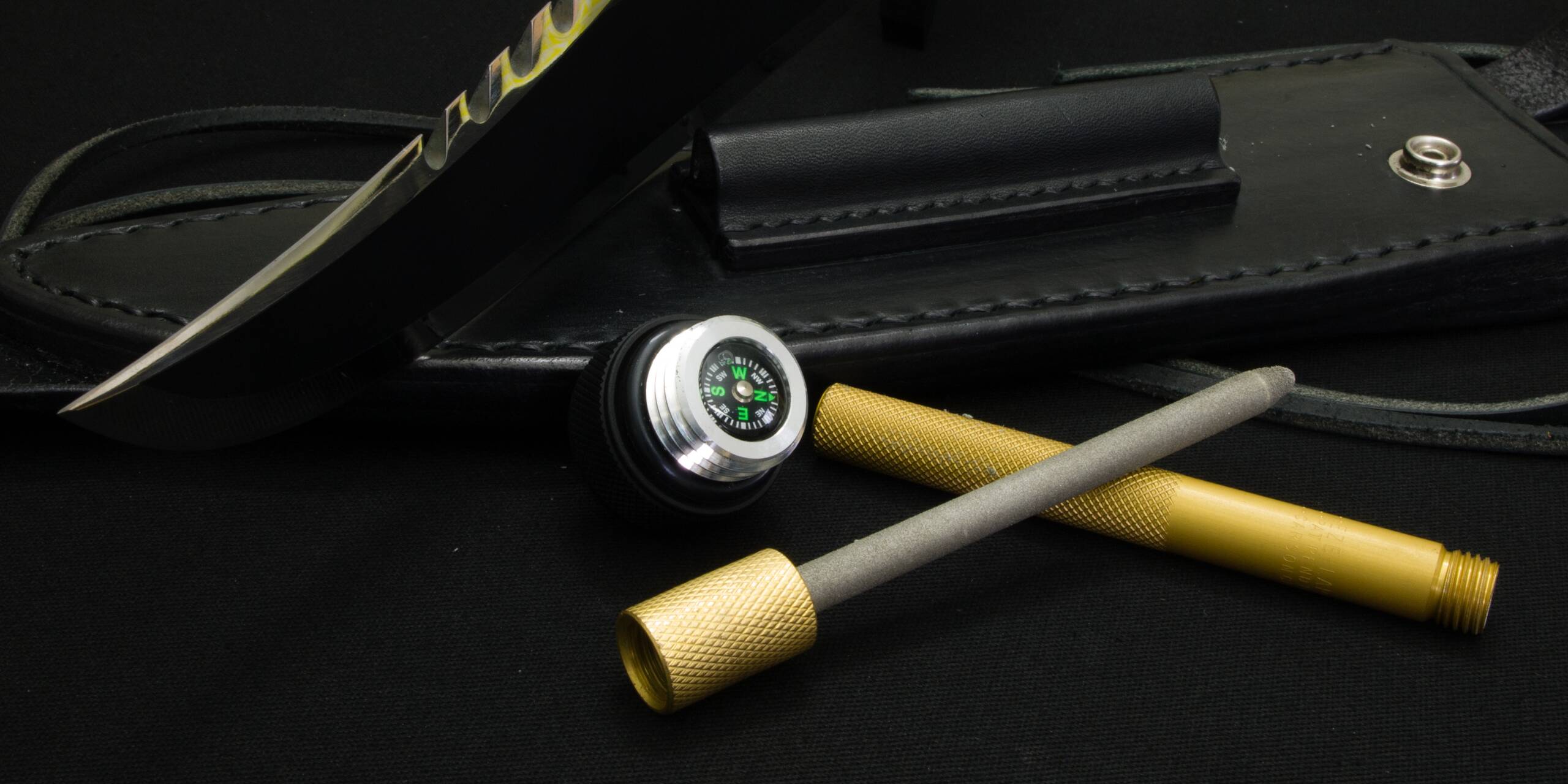 The handle cap with its compass and the EZE-LAP sharpener open, with its brass case