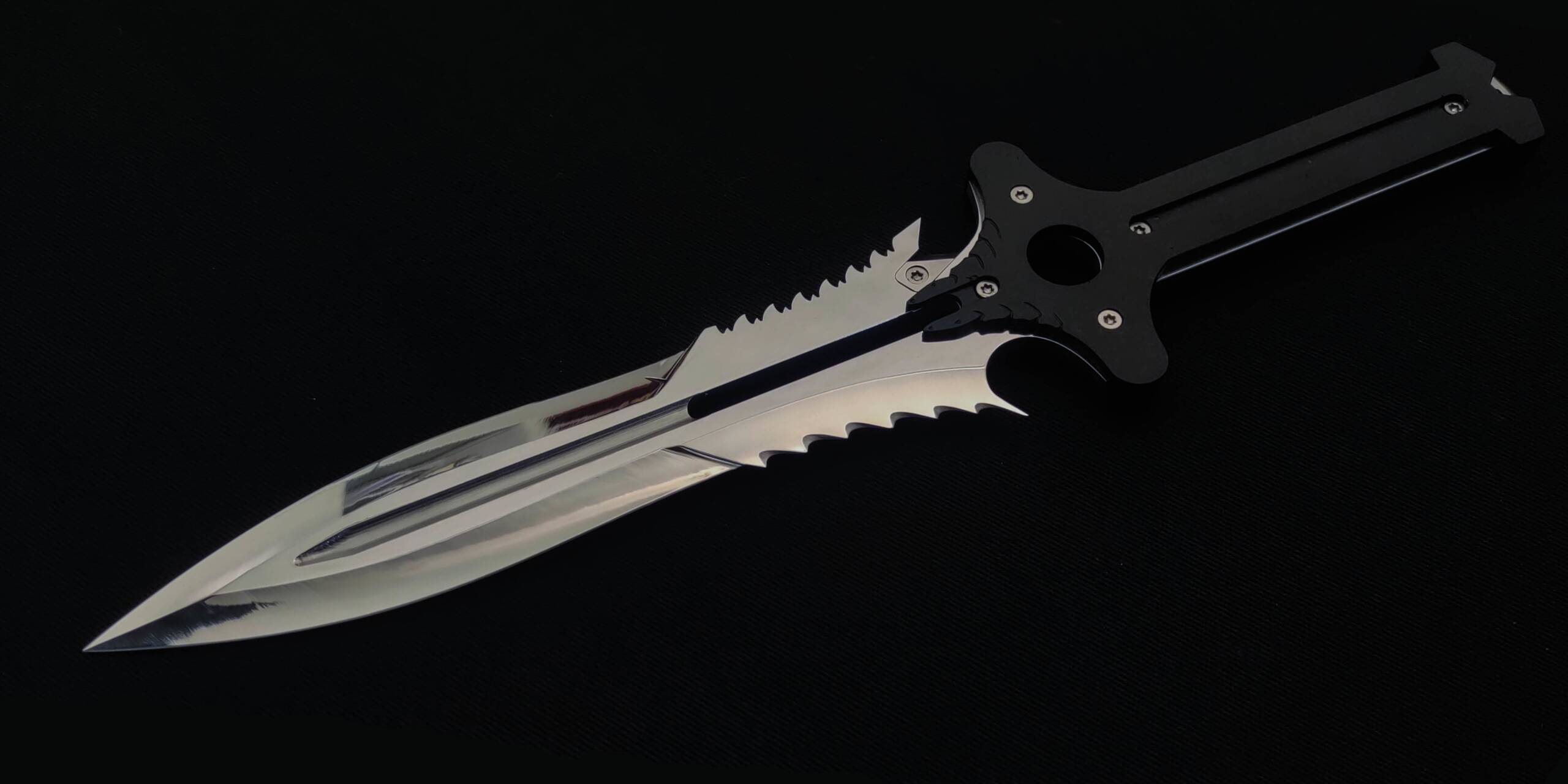 A custom dagger with a mirror-polished blade and flame filework, black fretted guard and handle, on a black background