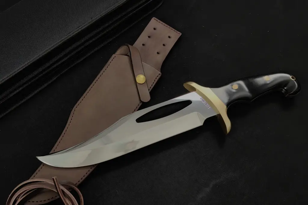 Replica of Jimmy Lile's prototype for Rambo III from the left, with the MAURO engraving on the heel and the leather sheath