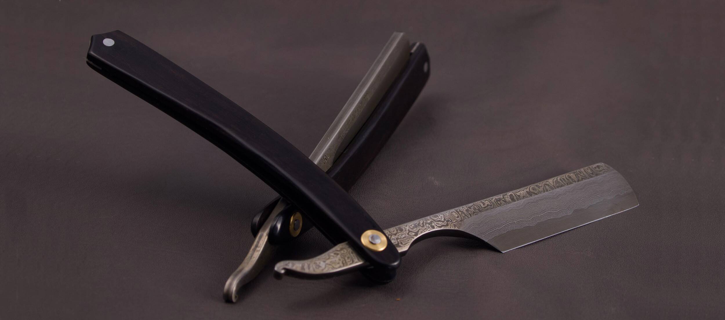 Open straight razor, Damascus steel blade with a black ebony handle
